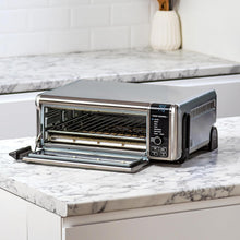 Load image into Gallery viewer, Ninja Foodi Four Multifonctions 8-en-1, Mini four portable, surfaces de travail, four multifonctions avec 8 fonctions de cuisson ; Air Fry, Rôtir, Griller, Cuire et plus encore. Argent/Noir SP101EU